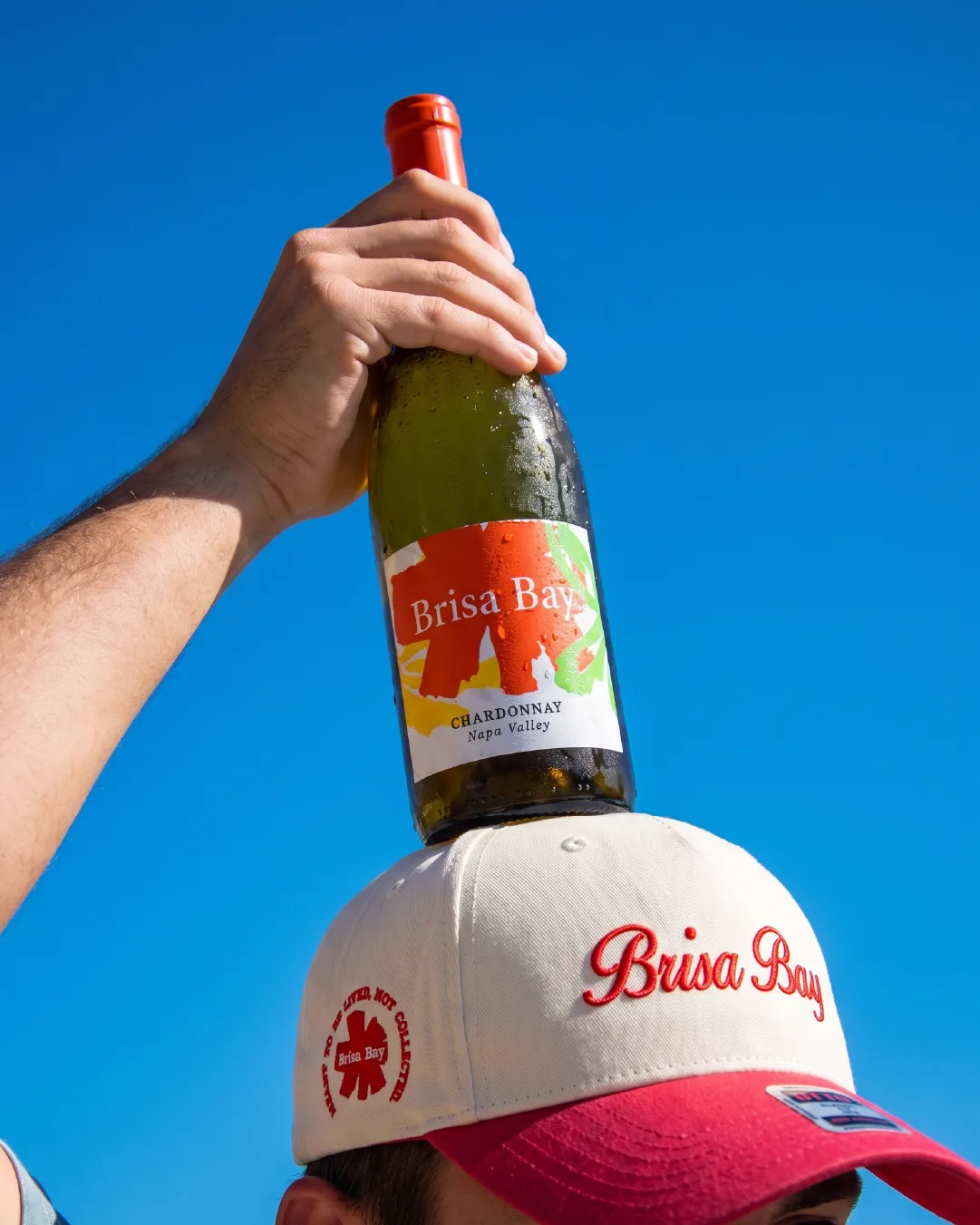 Brisa Bay bottle balanced on a cap